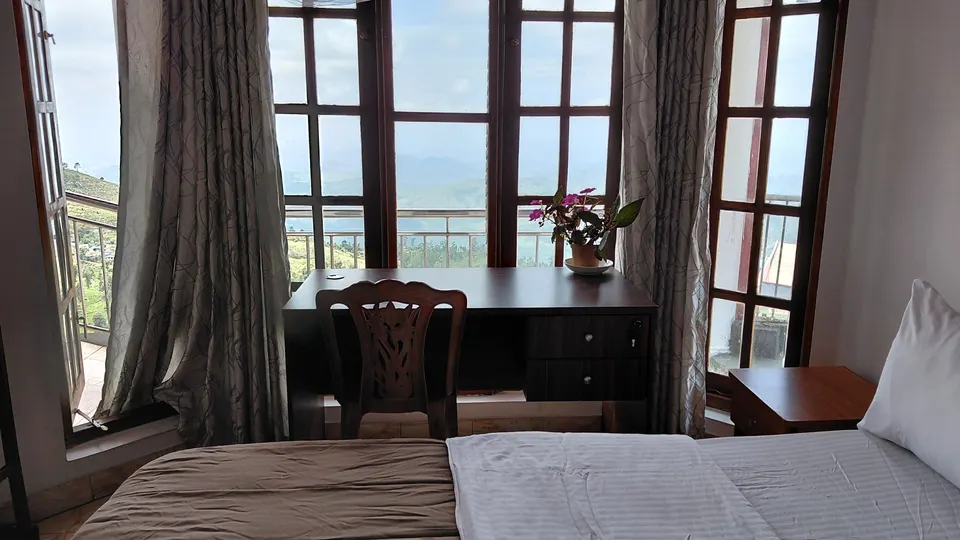 Window-facing angle of the same representative Standard Double Room at The Mist.