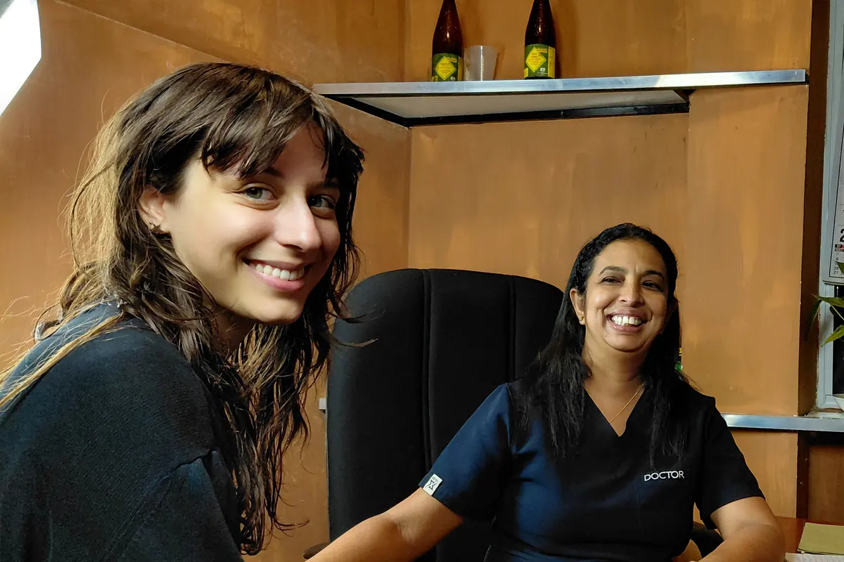 Dr. Walpolage Sandamali Samanthi smiling with a guest.